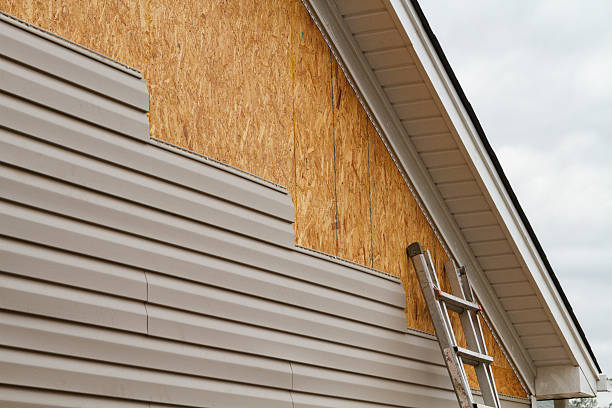 Professional Storm Damage Siding Repair technician working in Weston, OH